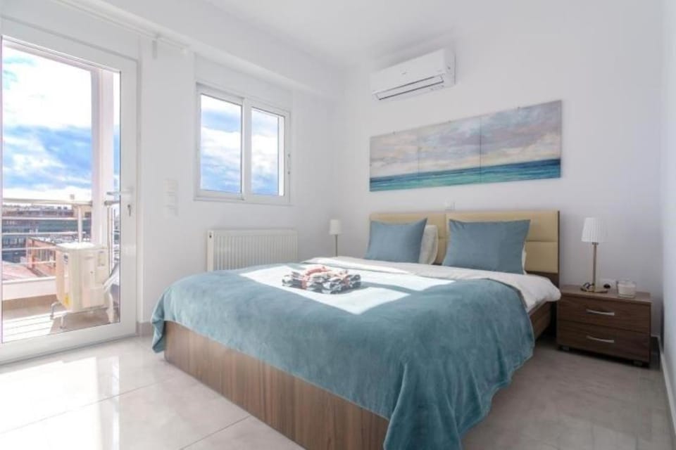 Bed, Bedroom, City view, towels, air conditioner
