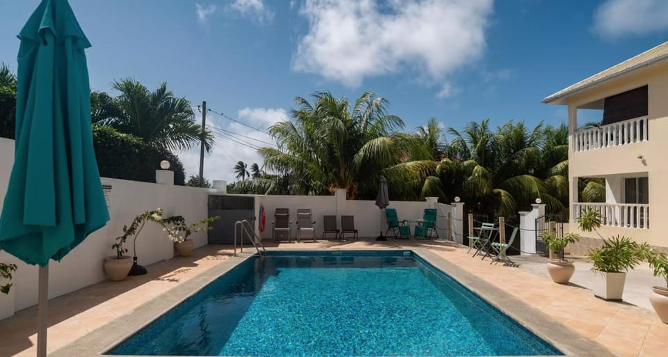 Property building, Pool view, Swimming pool, sunbed
