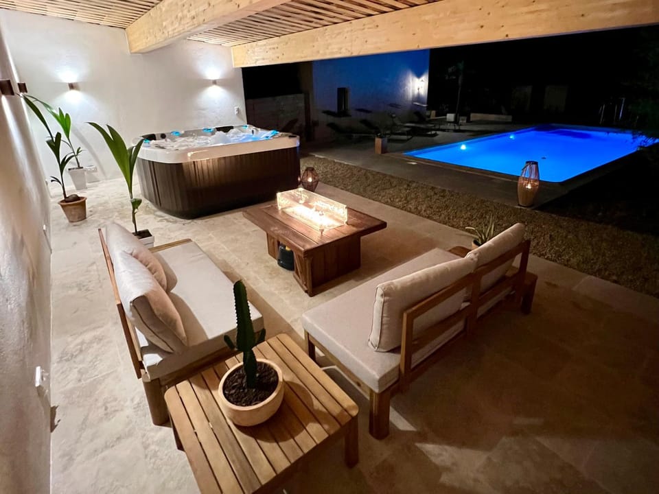 Patio, Night, Seating area, Pool view, Swimming pool