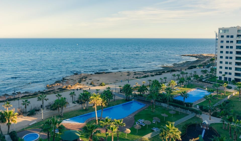 Property building, Nearby landmark, Day, Natural landscape, Beach, Pool view, Sea view, Swimming pool, Swimming pool