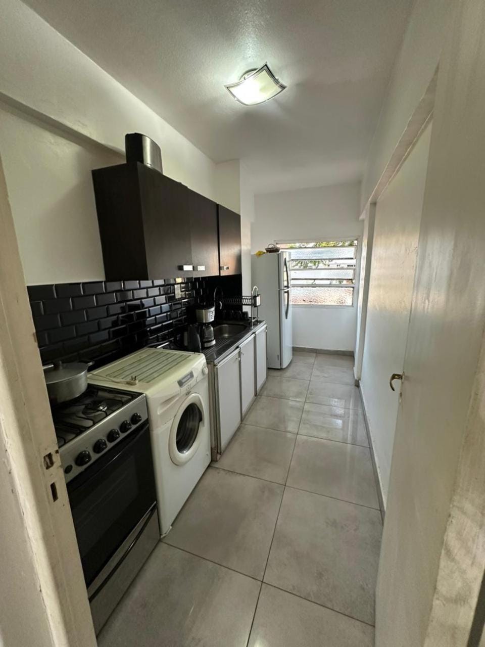 Kitchen or kitchenette, oven, washing machine, dryer