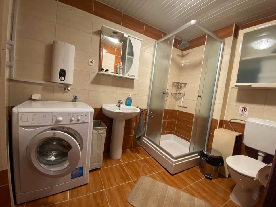 Shower, Toilet, Bathroom, towels, washing machine, dryer