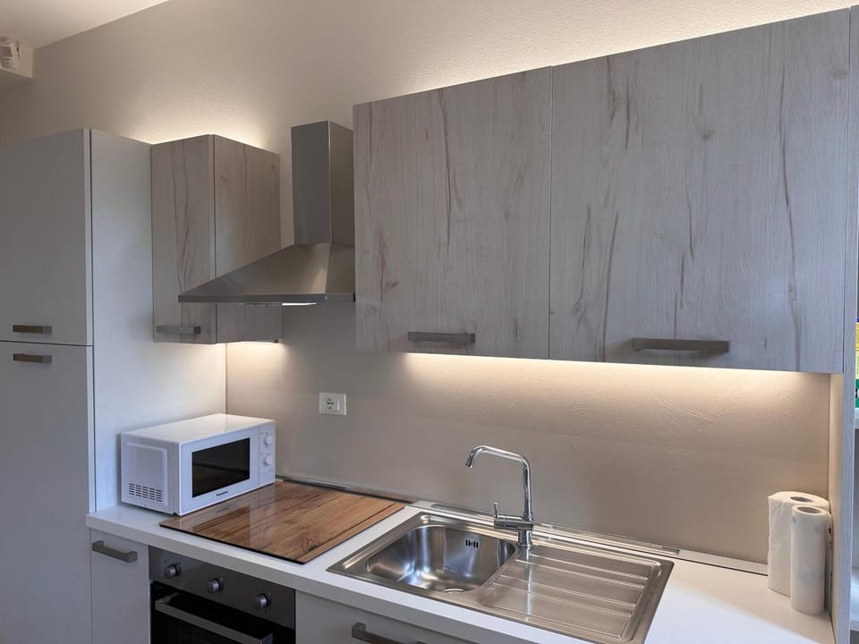 Kitchen or kitchenette, oven, stove
