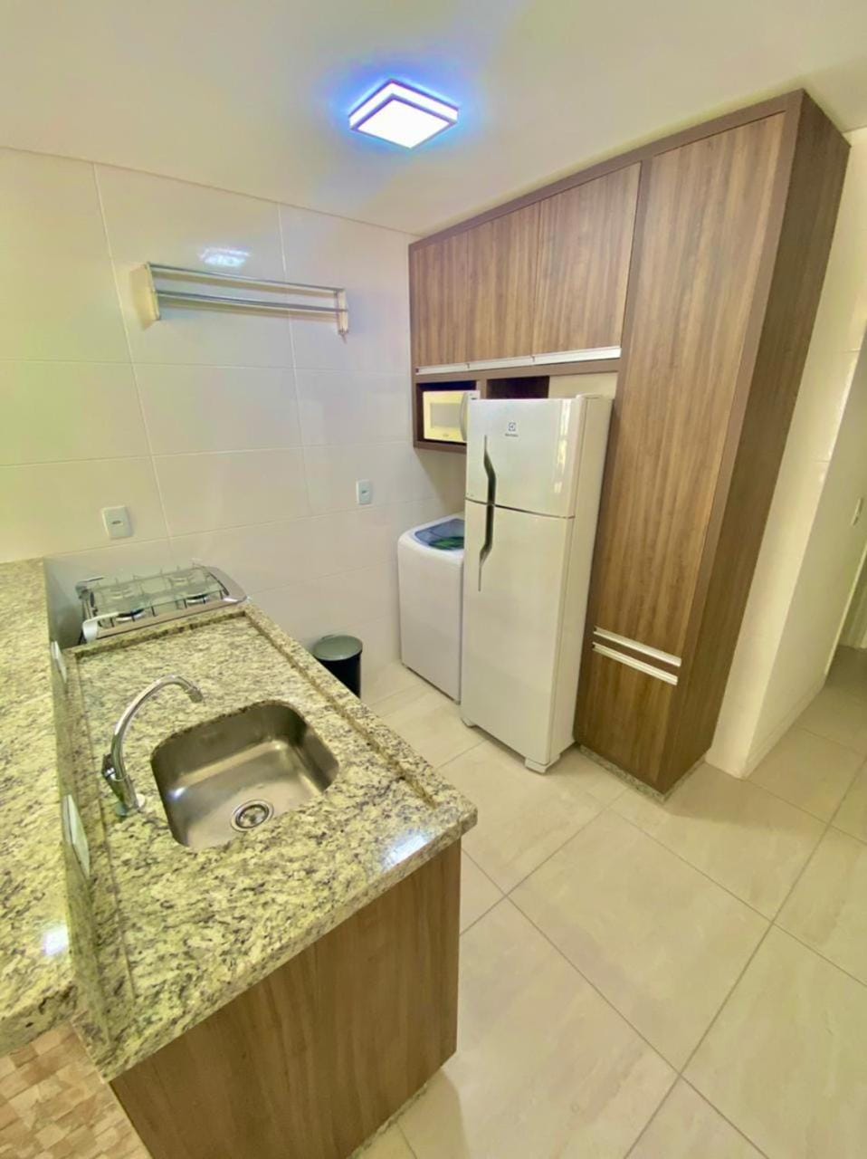 Kitchen or kitchenette, minibar, oven, stove, washing machine