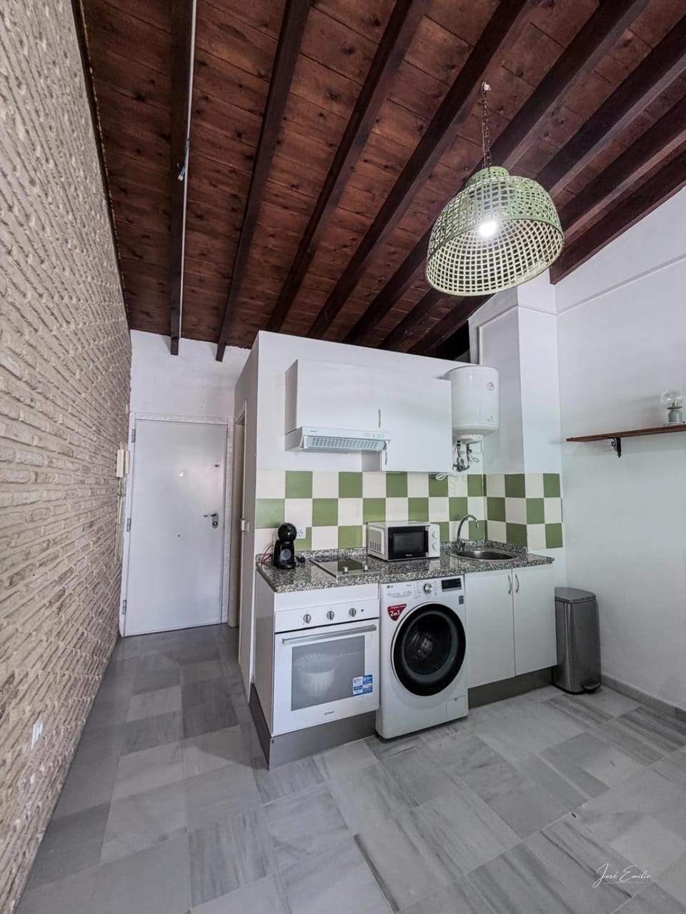Kitchen or kitchenette, oven, stove, washing machine, dryer