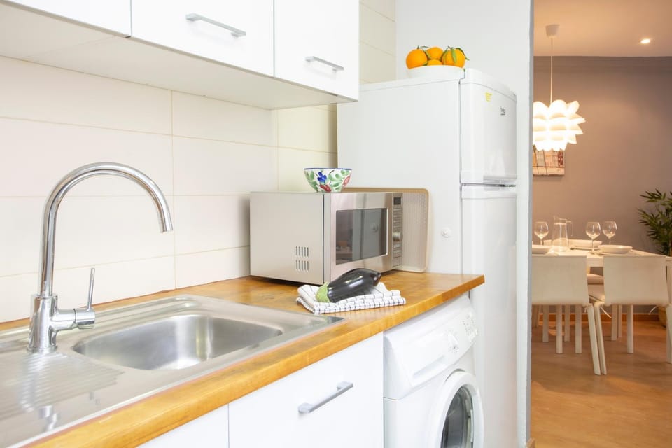 Kitchen or kitchenette, oven, stove, washing machine