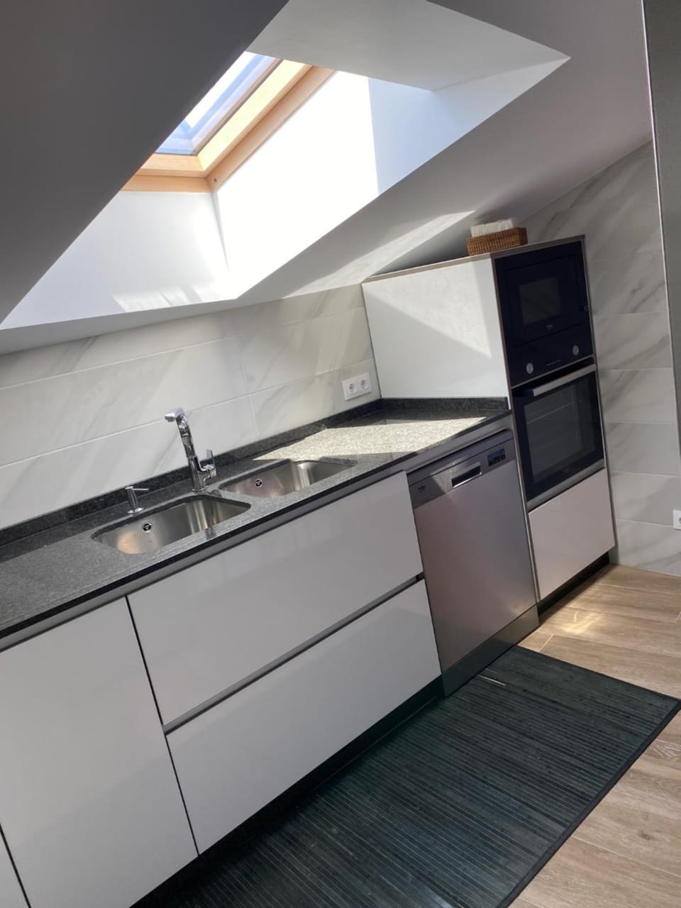 Kitchen or kitchenette, dishwasher, microwave, oven, stove, toaster