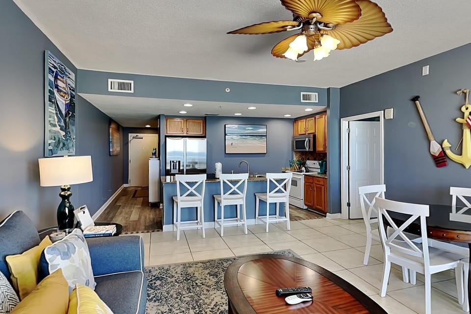 Kitchen or kitchenette, Living room, Seating area, Dining area, furniture, microwave, air conditioner