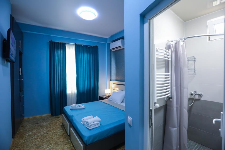 Shower, Bed, Bathroom, Photo of the whole room, Bedroom, towels, air conditioner