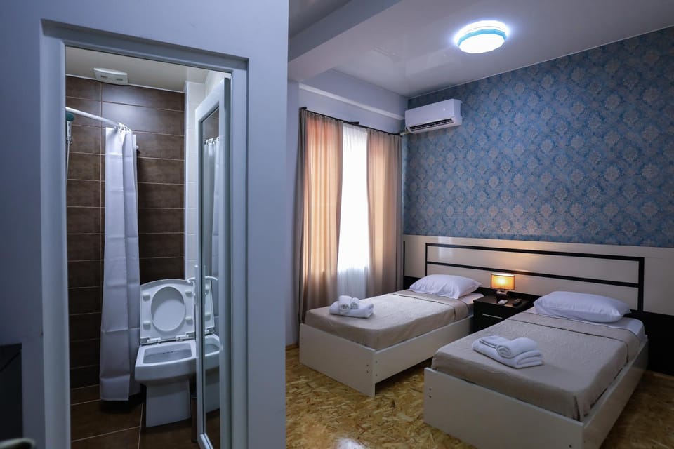 Bed, Bathroom, Photo of the whole room, Bedroom, towels, air conditioner