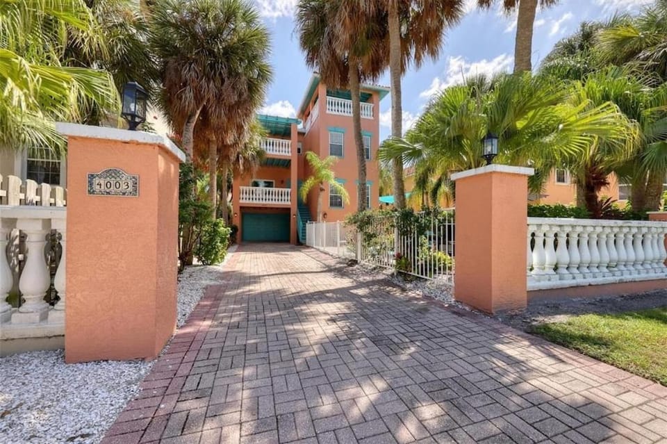 Tropical luxury pool home by the beach with roof top lounge centrally located on Anna Maria Island House in Holmes Beach
