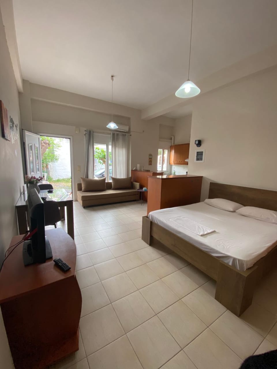 Bed, TV and multimedia, Living room, Seating area, Bedroom, hair dresser