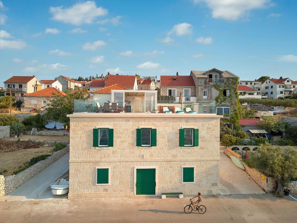 SEAFRONT NORTH HOUSE SUTIVAN - new luxury three-bedroom villa - unforgettable panoramic views of the sea - roof terrace with jacuzzi - first row next to the beach and right next to all facilities - secured parking Villa in Split-Dalmatia County