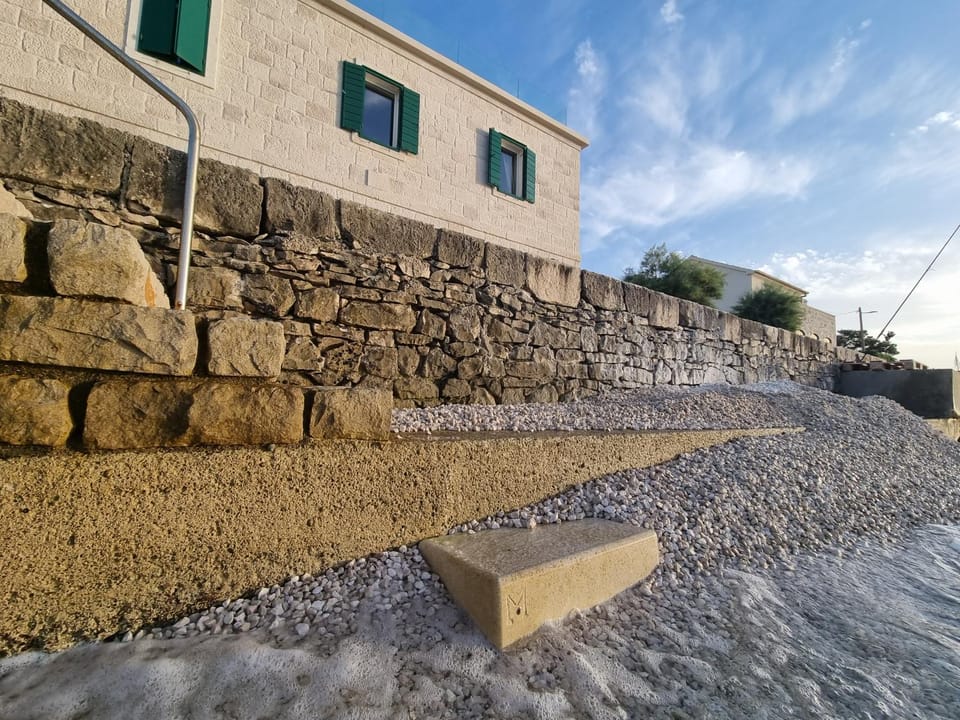 SEAFRONT NORTH HOUSE SUTIVAN - new luxury three-bedroom villa - unforgettable panoramic views of the sea - roof terrace with jacuzzi - first row next to the beach and right next to all facilities - secured parking Villa in Split-Dalmatia County