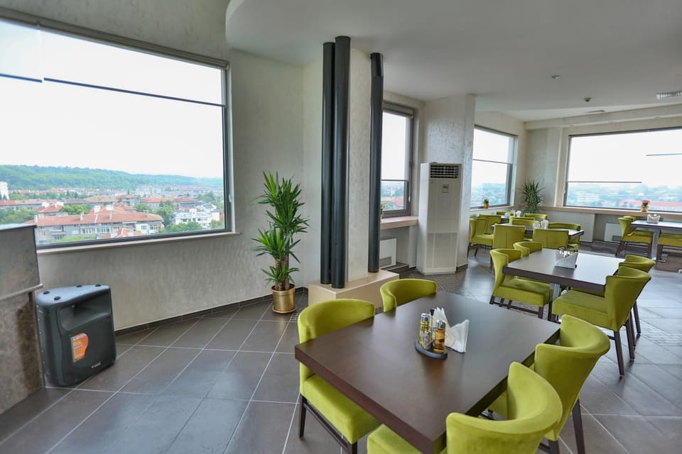 Property building, People, View (from property/room), Food and drinks, Food, City view, Mountain view, Street view, Drinks, Alcoholic drinks, Non alcoholic drinks, Family