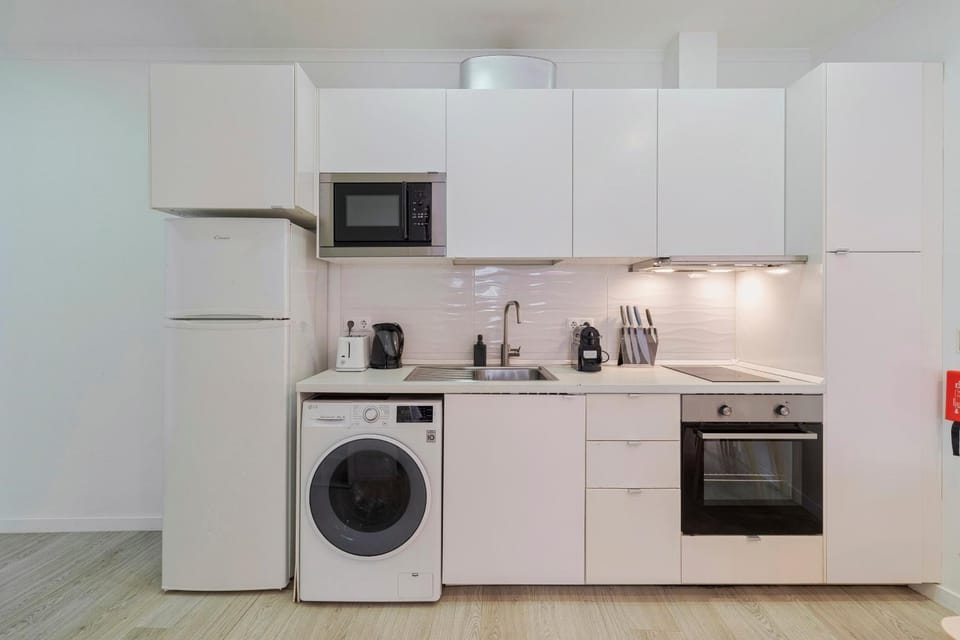 Kitchen or kitchenette, oven, stove, toaster, washing machine