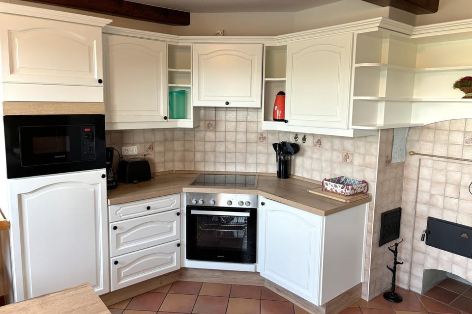 Kitchen or kitchenette, dishwasher, oven, stove