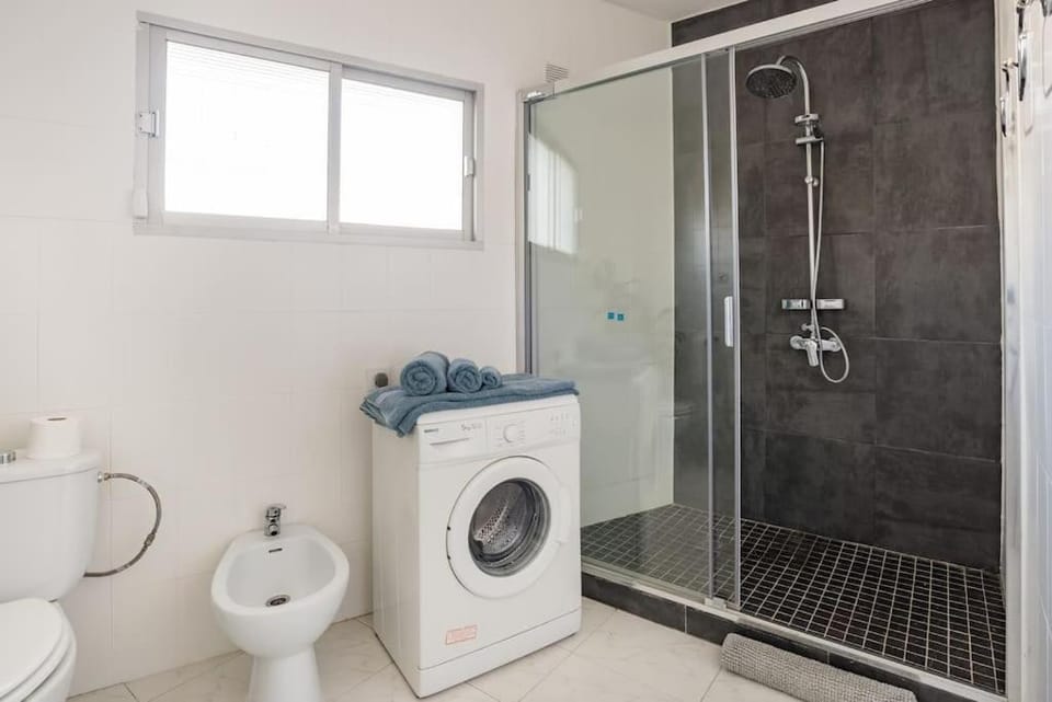 Shower, Toilet, towels, washing machine