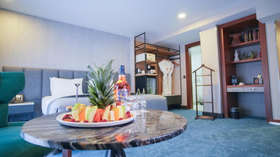 Photo of the whole room, oven, towels