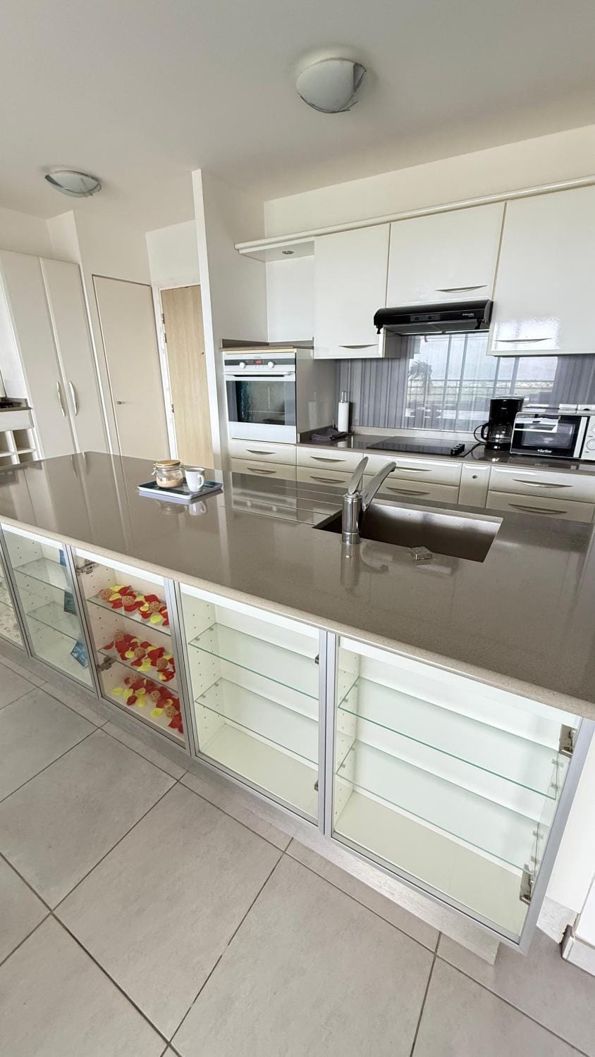 Kitchen or kitchenette, dishwasher, oven, stove