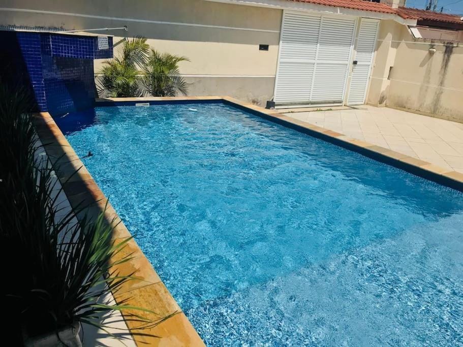 Casa de praia com piscina e churrasqueira - Indaiá Bertioga House in Bertioga