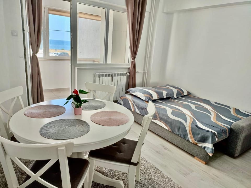 Bed, Living room, Seating area, Sea view