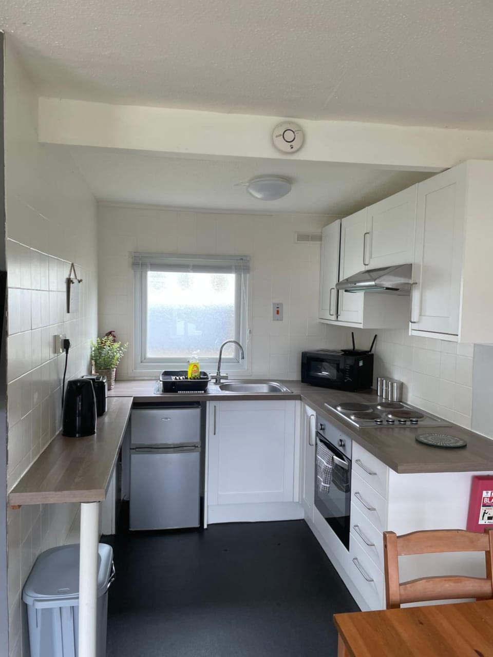 Kitchen or kitchenette, microwave, oven, stove, toaster