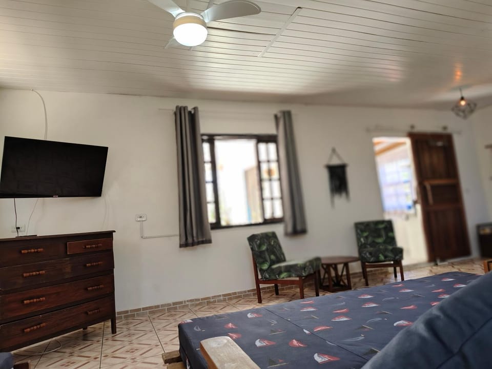 Communal lounge/ TV room, Bed, TV and multimedia, Living room, Photo of the whole room, Seating area, Bedroom