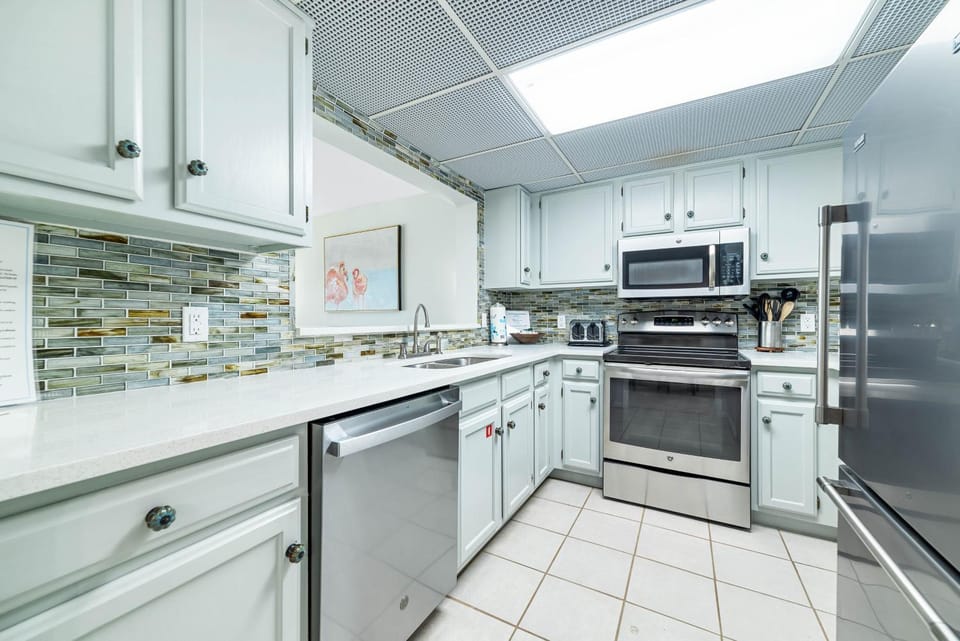 Kitchen or kitchenette, dishwasher, oven, stove, toaster