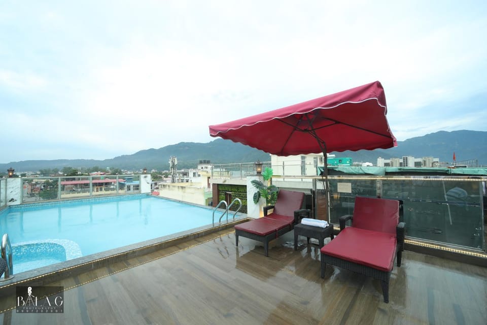 Property building, Patio, View (from property/room), Balcony/Terrace, Mountain view, Pool view, Swimming pool, sunbed