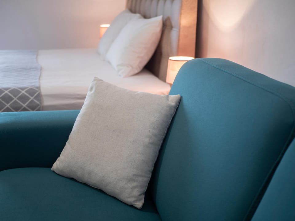 Bed, Living room, Seating area, Bedroom