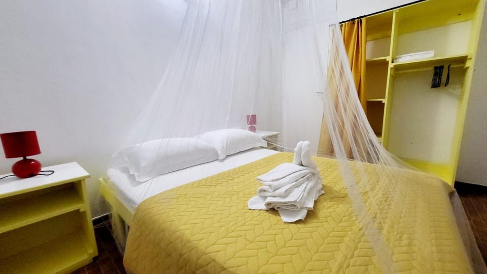 Bed, Bedroom, fireplace, storage, towels, wardrobe