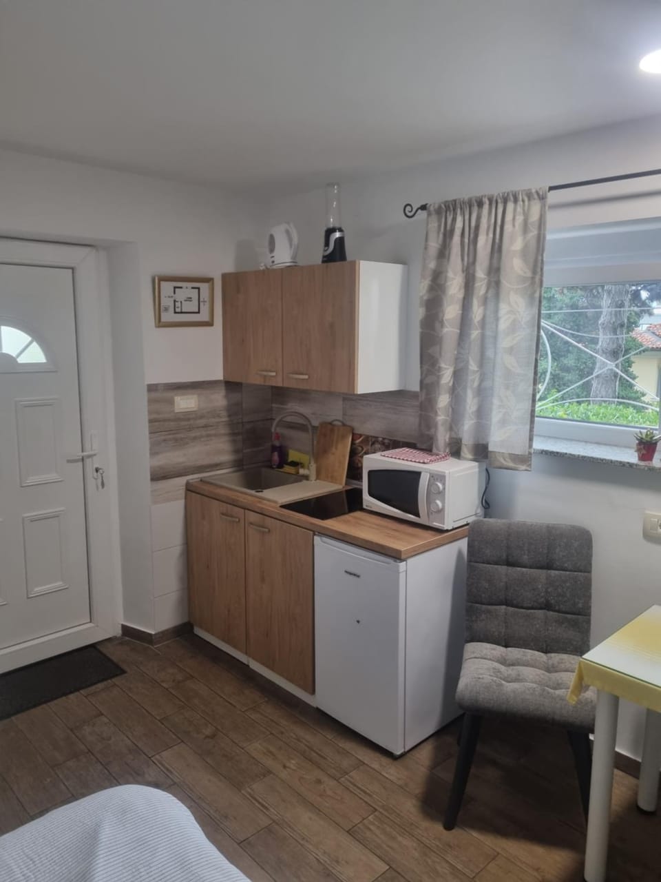 Kitchen or kitchenette, stove, toaster