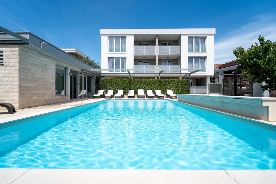 Property building, Pool view, Swimming pool, sunbed