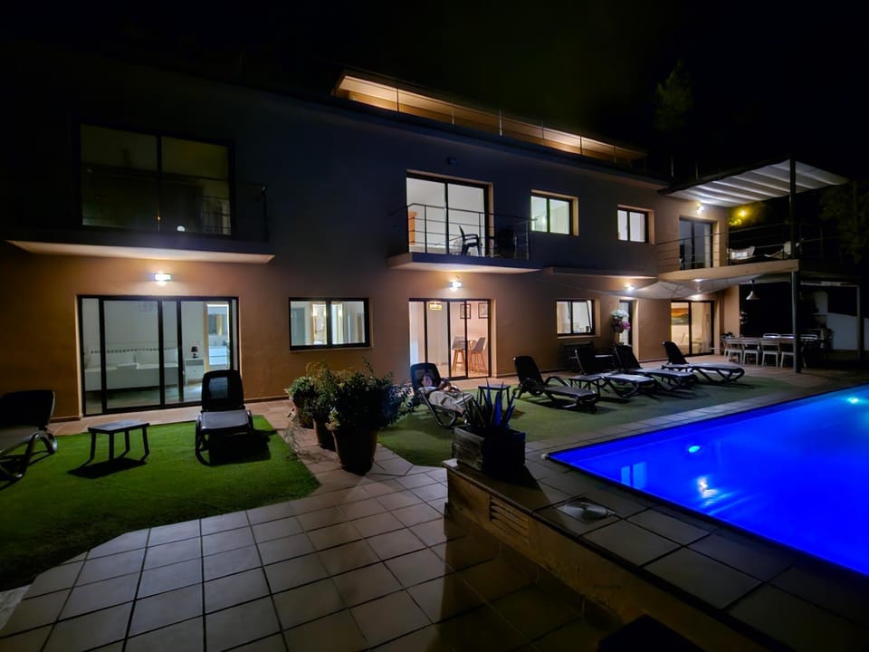 Property building, Night, Pool view, Swimming pool, sunbed