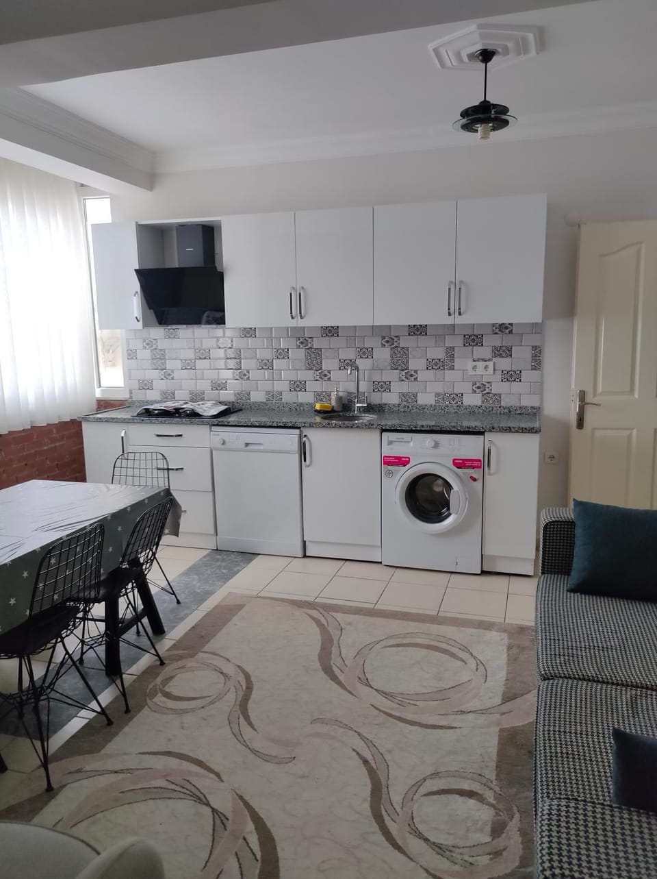 Kitchen or kitchenette, Dining area, dishwasher, stove, washing machine