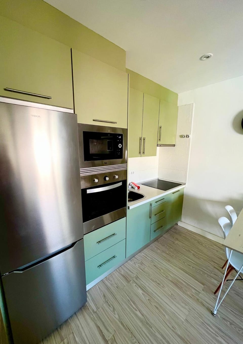 Kitchen or kitchenette, dishwasher, oven, stove