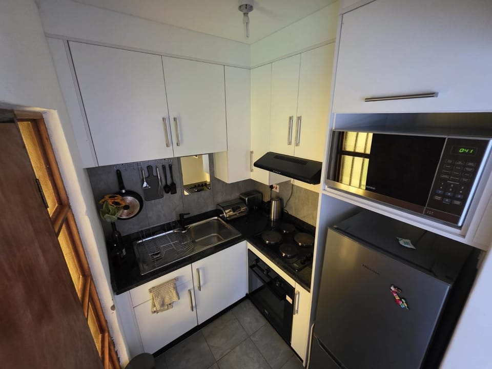 Kitchen or kitchenette, oven, stove