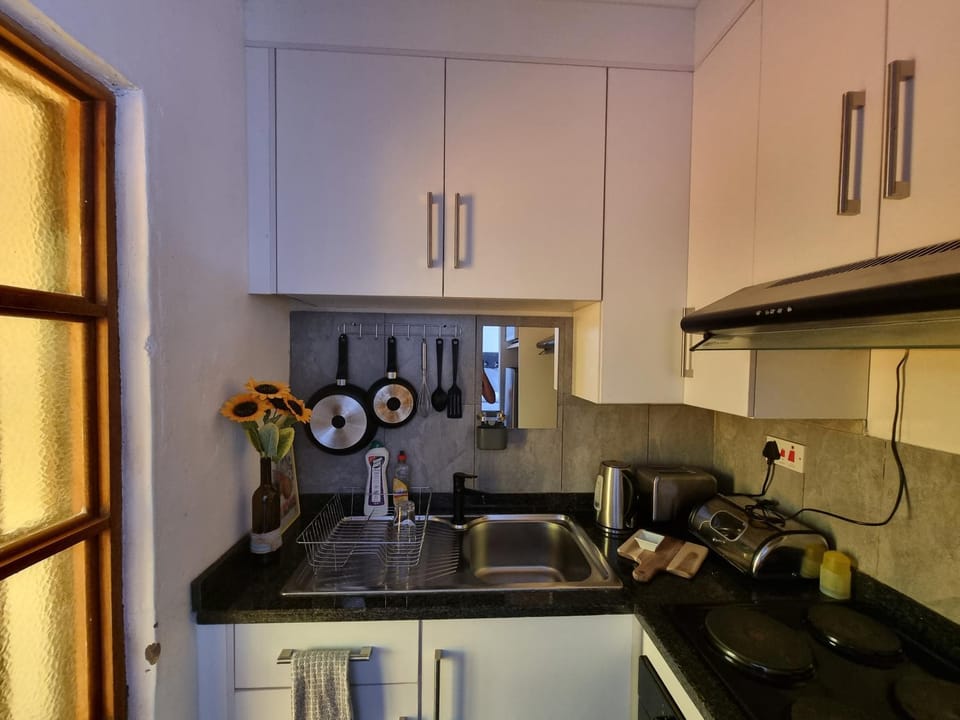 Kitchen or kitchenette, oven, stove, toaster