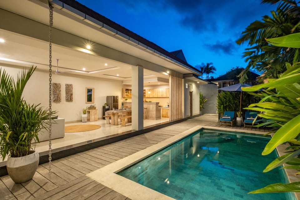Property building, Patio, Night, Natural landscape, Pool view, Swimming pool, sunbed