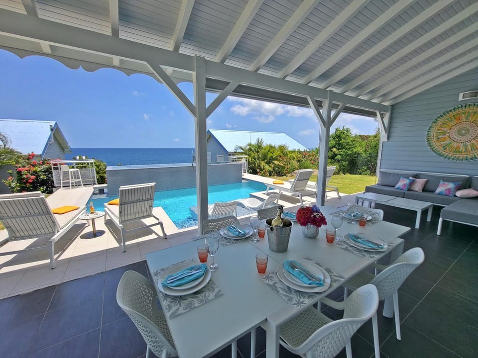 Patio, Day, View (from property/room), Balcony/Terrace, Balcony/Terrace, Seating area, Dining area, Pool view, Sea view, Swimming pool, sunbed
