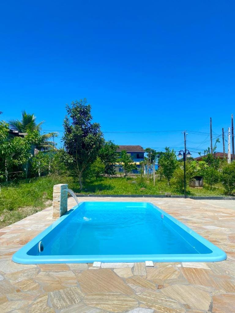 Apartamento em chácara próximo as praias com piscina e quiosque com internet Apartment in São Francisco do Sul