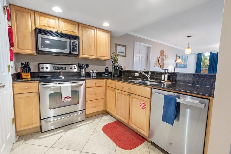 Kitchen or kitchenette, dishwasher, oven, stove, toaster