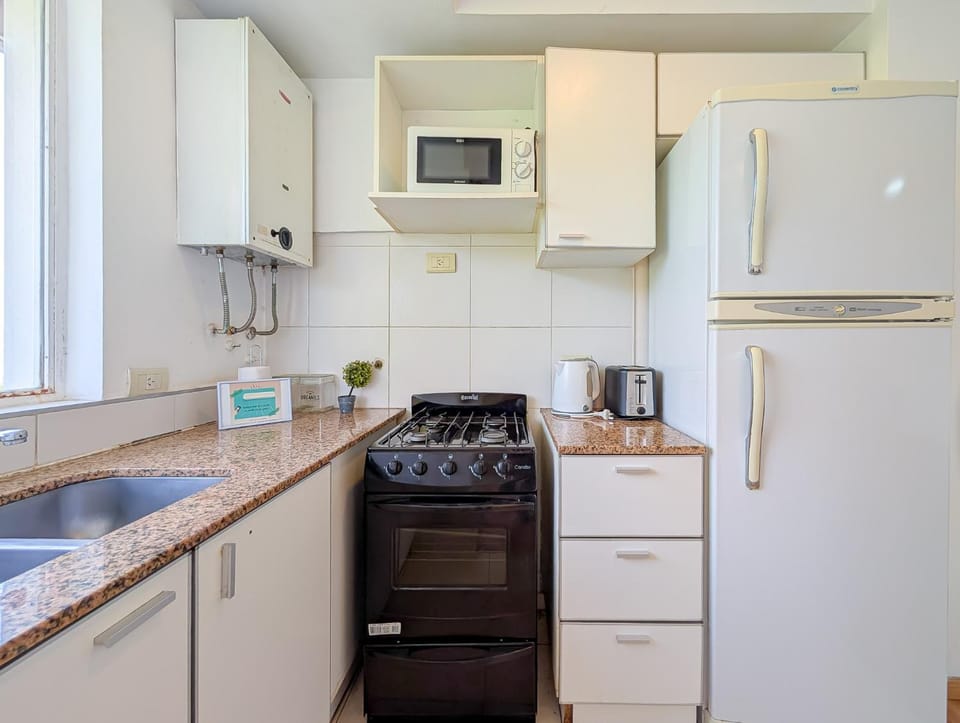 Kitchen or kitchenette, oven, stove, toaster