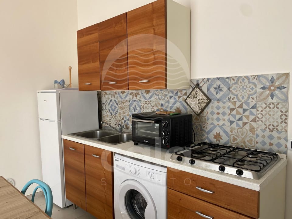 Kitchen or kitchenette, stove, washing machine, kitchen
