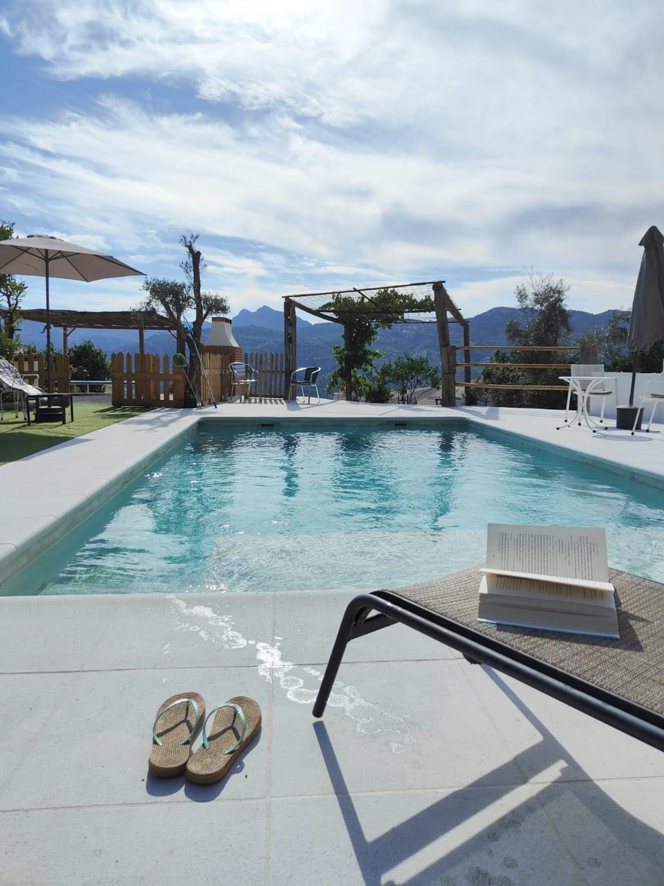 Patio, Day, Natural landscape, Pool view, Swimming pool, sunbed