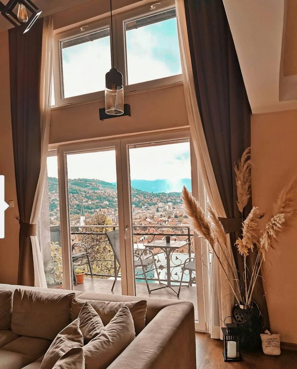 View (from property/room), Balcony/Terrace, Living room, Seating area, City view, Mountain view