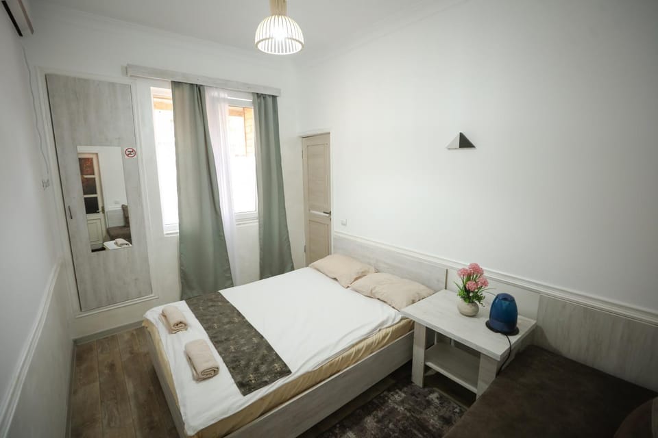 Bed, Photo of the whole room, Seating area, Bedroom, towels, wardrobe, air conditioner