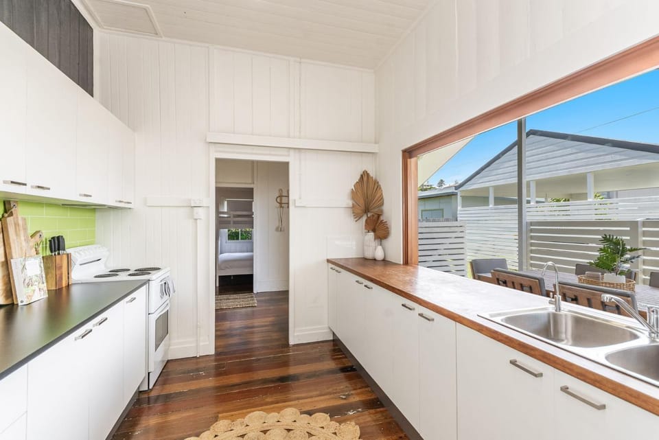 Kitchen or kitchenette, dishwasher, oven, stove