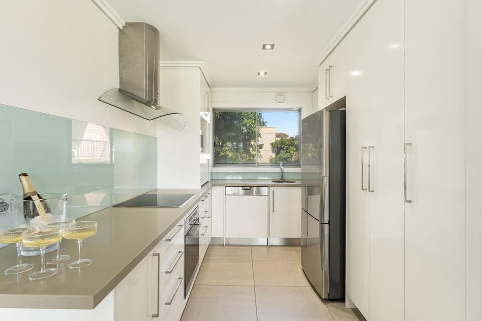 Kitchen or kitchenette, dishwasher, oven, stove